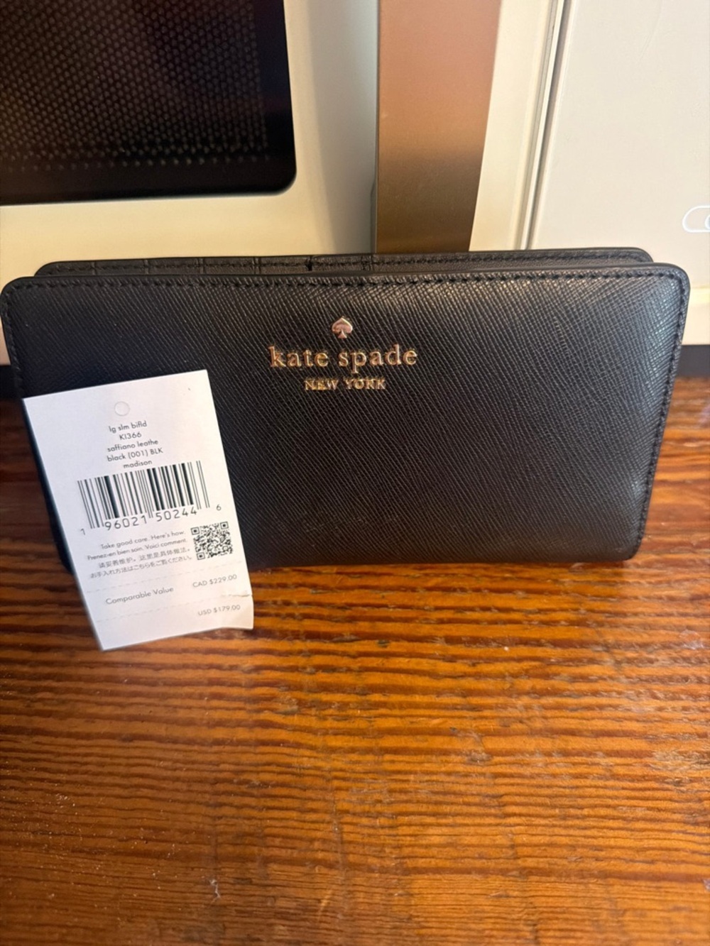 kate spade Black Saffiano Zip Wallet with Gold Logo